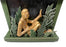 Seated gold man in foliage