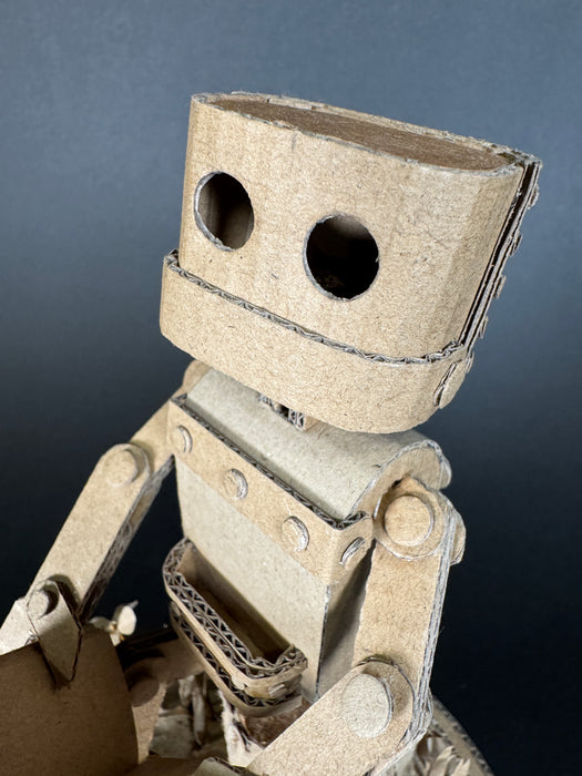 Paper Robot (Reading on stump)